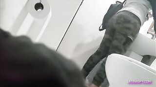 MILF with huge ass takes off pants in the bathroom