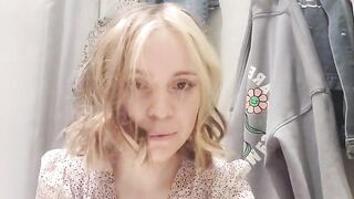 Russian Sudent trying on a Dress in a Fitting Room