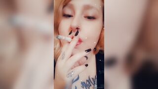 Girl with Fat Lips Smokes a Cigar