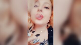 Girl with Fat Lips Smokes a Cigar