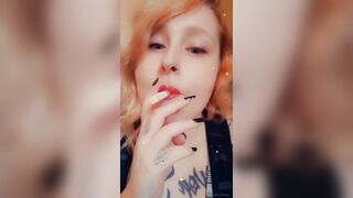 Girl with Fat Lips Smokes a Cigar