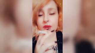 Girl with Fat Lips Smokes a Cigar