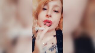 Girl with Fat Lips Smokes a Cigar