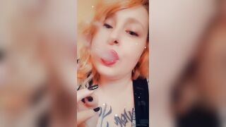 Girl with Fat Lips Smokes a Cigar