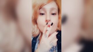 Girl with Fat Lips Smokes a Cigar