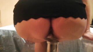 Cute mom with a huge ass jumps on a dildo on the table