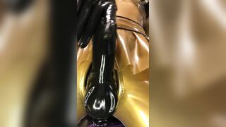 Gold rubber doll