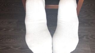 STUDENT GIRL SHOWS WHITE SOCKS AND FEET AFTER STUDYING.