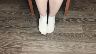 STUDENT GIRL SHOWS WHITE SOCKS AND FEET AFTER STUDYING.