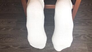 STUDENT GIRL SHOWS WHITE SOCKS AND FEET AFTER STUDYING.