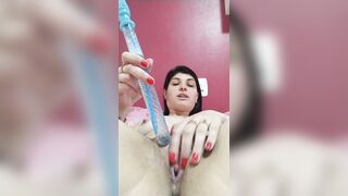 brunette punching toy in pussy