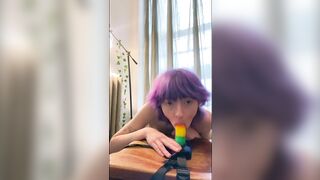 Rainbow dildo blowjob