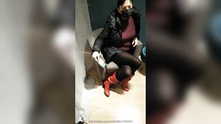 Fully dressed crossed legs orgasm in a store