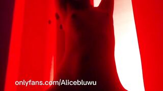 Sexy body of a Latina brunette in red light