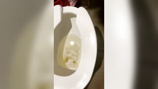 Fatty teen is pissing powerfully in public toilet close up