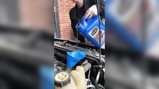 Girl fills oil up in her car and flashes tits