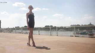 Black high heel sandals by the river