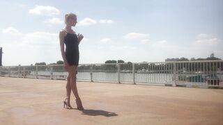 Black high heel sandals by the river