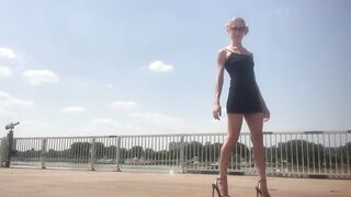 Black high heel sandals by the river