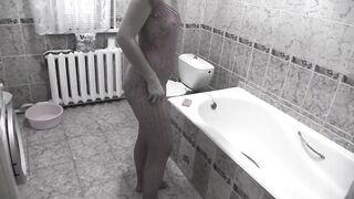 Bathroom piss slim mature MILF.