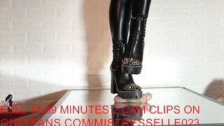 Mistress elle presents her spiked boots to her slave