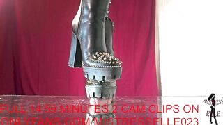 Mistress elle presents her spiked boots to her slave