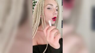 girl with red lips smokes cigarettes