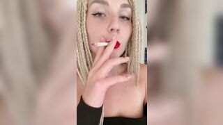 girl with red lips smokes cigarettes