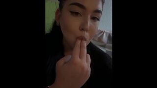 She loves to suck fingers and then caress her pussy