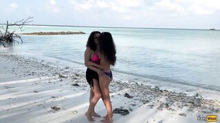 Girls piss on each other on a snow-white beach and play with splashes