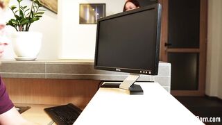 Fucking a redhead behind her working desk