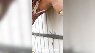 Milf in boots pees at the fence