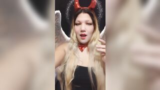 Angel of hell. Halloween costume. Cute girls smoke with me