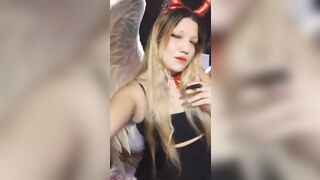 Angel of hell. Halloween costume. Cute girls smoke with me