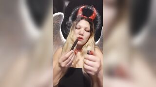 Angel of hell. Halloween costume. Cute girls smoke with me