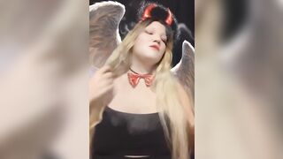 Angel of hell. Halloween costume. Cute girls smoke with me