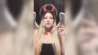 Angel of hell. Halloween costume. Cute girls smoke with me